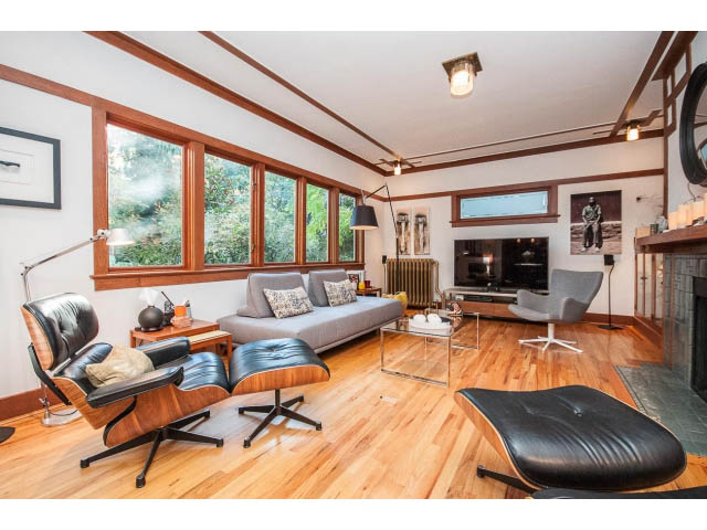 Spacious living room with hardwood floors, modern furniture, and large windows. - 1015 West 16th Ave, Vancouver West Side