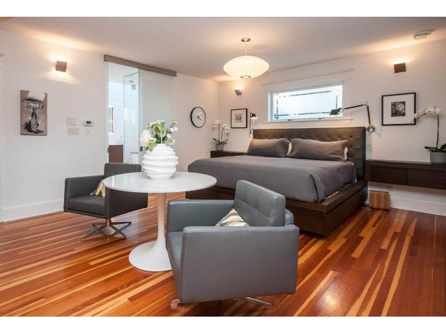 Furnished living room with hardwood floors, modern furniture, and a cozy ambiance. - 1015 West 16th Ave, Vancouver West Side