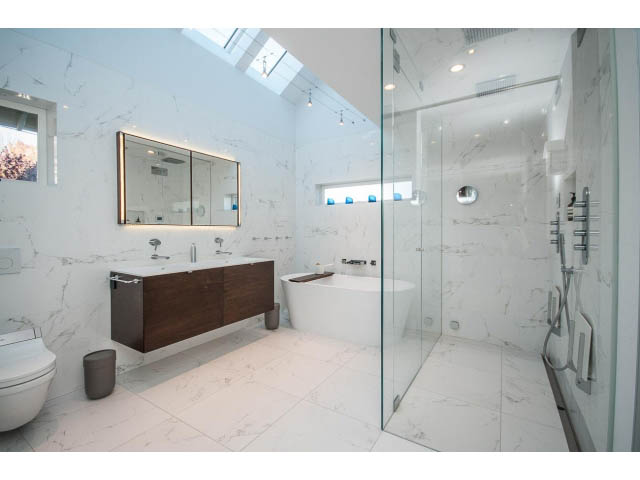 Spacious bathroom with marble countertops and glass shower. - 1015 West 16th Ave, Vancouver West Side