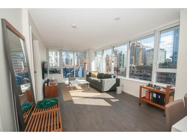 Furnished living room with hardwood floors, city view, and modern decor. - 805 - 1009 Harwood Street, Vancouver Downtown