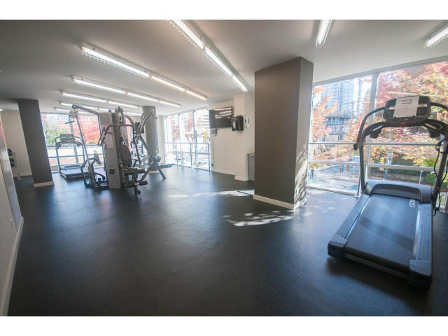 Spacious fitness room with treadmills, city view, and modern equipment. - 805 - 1009 Harwood Street, Vancouver Downtown