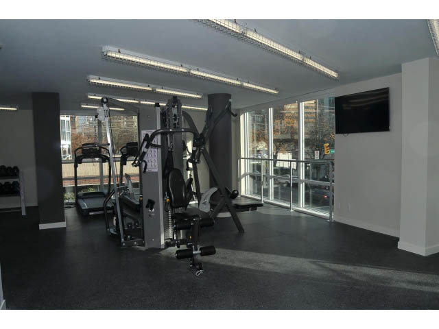 Bright gym with city view, modern equipment, and large windows. - 805 - 1009 Harwood Street, Vancouver Downtown