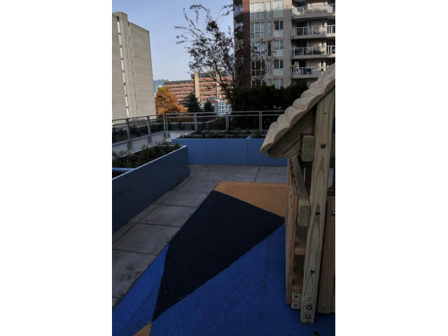 Furnished living room with city view and wooden furniture. - 805 - 1009 Harwood Street, Vancouver Downtown