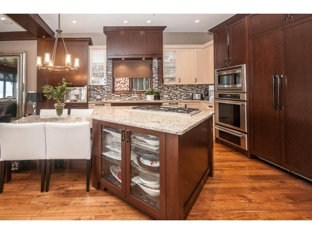 Bright kitchen with granite countertops, hardwood floors, and a modern island. - 3765 Dollarton Hwy, North Vancouver