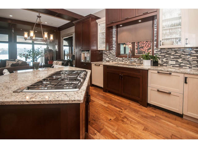 Bright kitchen with granite countertops, hardwood floors, and a city view. - 3765 Dollarton Hwy, North Vancouver