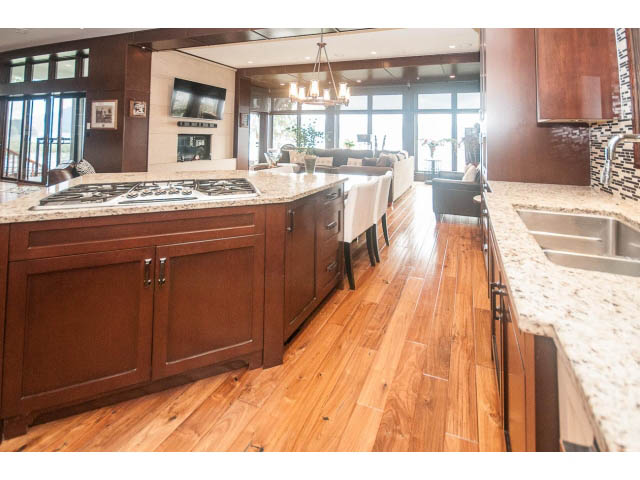 Bright kitchen with granite countertops, hardwood floors, and a city view. - 3765 Dollarton Hwy, North Vancouver