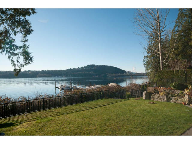 Spacious backyard with grass and lake view. - 3765 Dollarton Hwy, North Vancouver