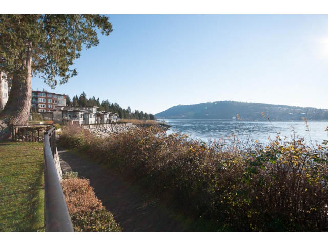 Spacious living room with a view of the water and mountains. - 3765 Dollarton Hwy, North Vancouver