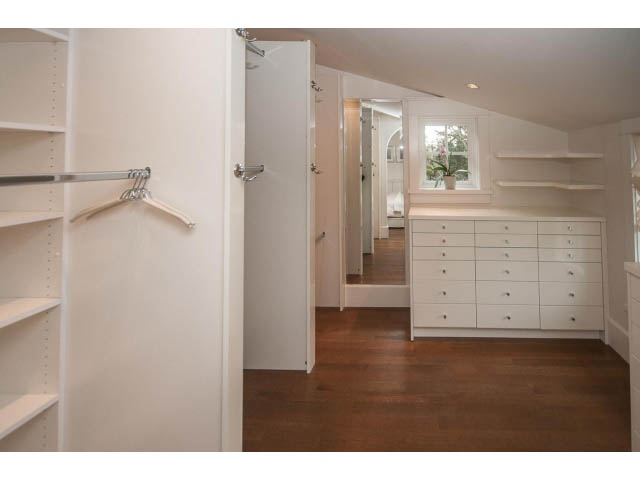 Spacious walk-in closet with built-in shelves and hardwood floors. - 1973 W 15th Ave, Vancouver West Side