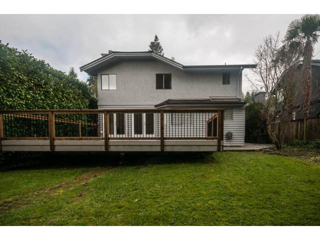Bright 4-bedroom house with a spacious deck and lush green lawn. - 4428 Marine Drive, West Vancouver
