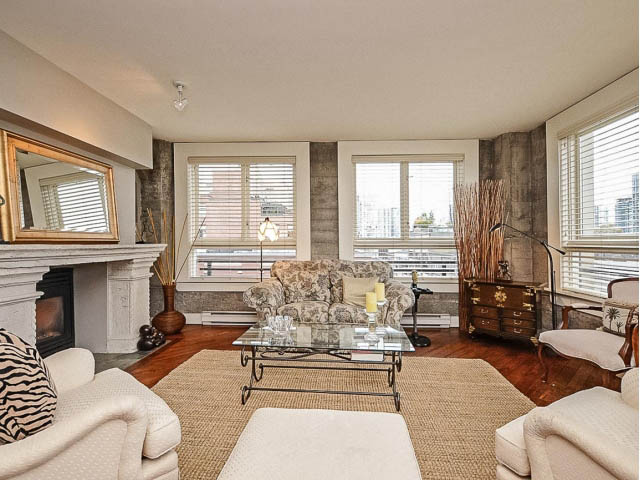 Bright living room with hardwood floors, city view, and cozy furnishings. - 509 - 1216 Homer Street, Vancouver Downtown