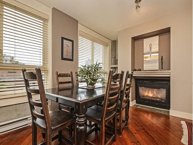 Furnished dining area with hardwood floors and city view. - 509 - 1216 Homer Street, Vancouver Downtown