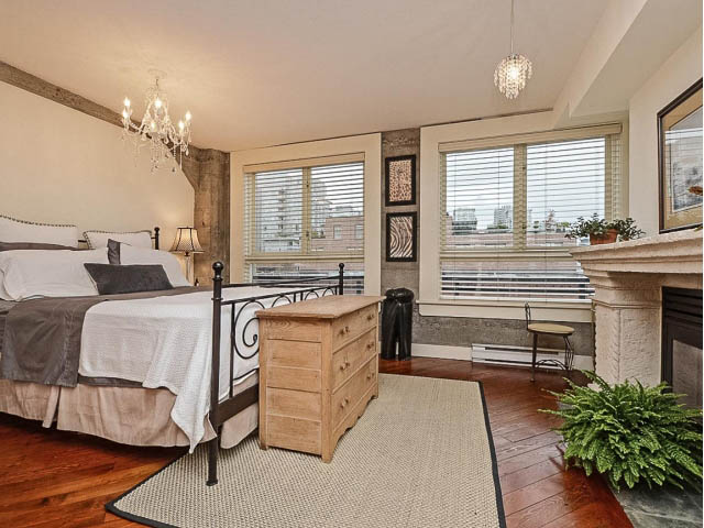 Furnished loft bedroom with hardwood floors, city view, and chandelier. - 509 - 1216 Homer Street, Vancouver Downtown
