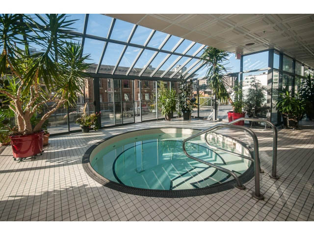 Spacious sunlit atrium with glass ceiling, indoor pool, and city views. - 1406 - 1060 Alberni Street, Vancouver Downtown