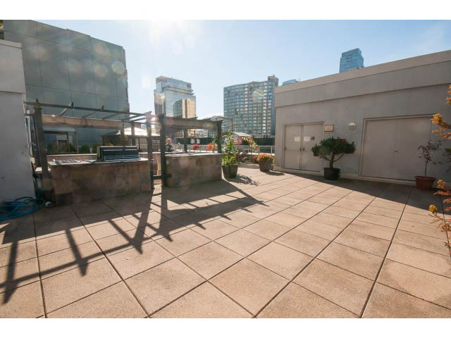 Bright rooftop patio with city view, furnished seating, and modern decor. - 1406 - 1060 Alberni Street, Vancouver Downtown