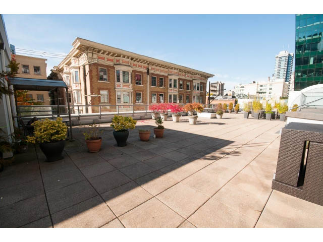 Furnished rooftop patio with city view and potted plants. - 1406 - 1060 Alberni Street, Vancouver Downtown