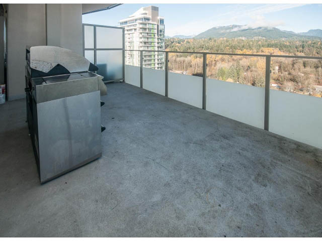 Furnished balcony with concrete flooring and city view. - 2401 - 1550 Fern Street, North Vancouver