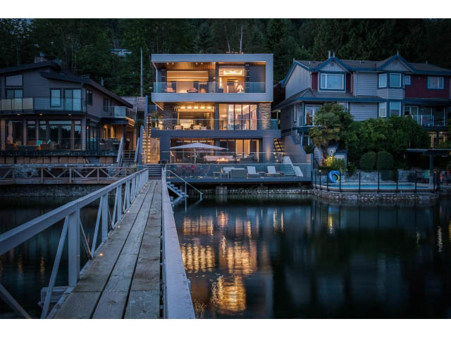 Spacious living room with large windows, waterfront view, and modern furnishings. - Address WITHHELD, Burnaby