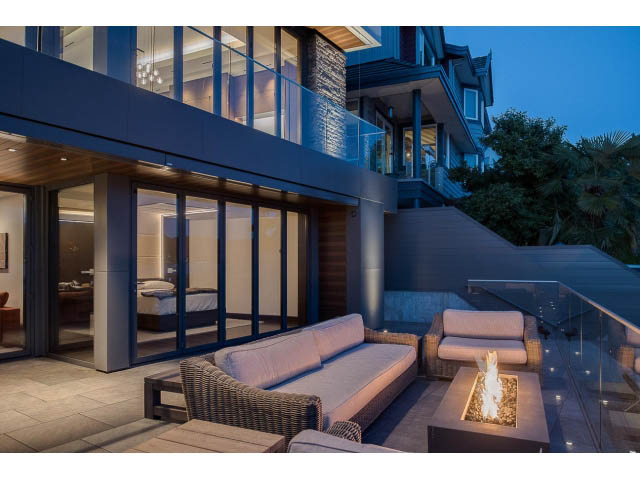 Furnished living room with modern furniture and a cozy fire pit. - Address WITHHELD, Burnaby