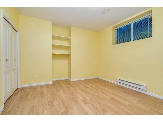 Bright den with hardwood floors and built-in shelving. - 4287 Madeley Rd, North Vancouver