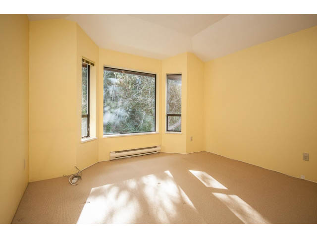 Spacious den with large windows, carpeted floor, and natural light. - 5138 Meadfeild Road, West Vancouver
