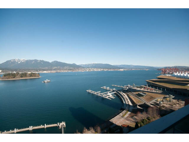 Bright living room with stunning city view and marina, featuring a large balcony. - 2200 - 1169 W Cordova St, Vancouver Downtown