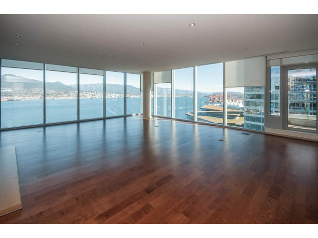 Spacious living room with hardwood floors, city view, and large windows. - 2200 - 1169 W Cordova St, Vancouver Downtown