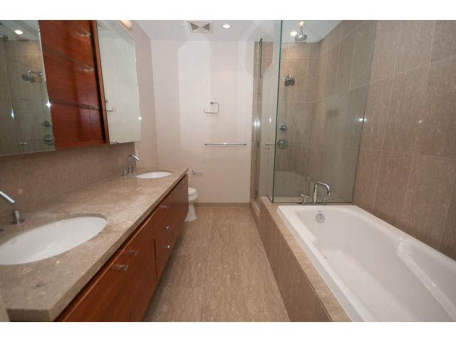 Furnished bathroom with granite countertops and a walk-in shower. - 2200 - 1169 W Cordova St, Vancouver Downtown