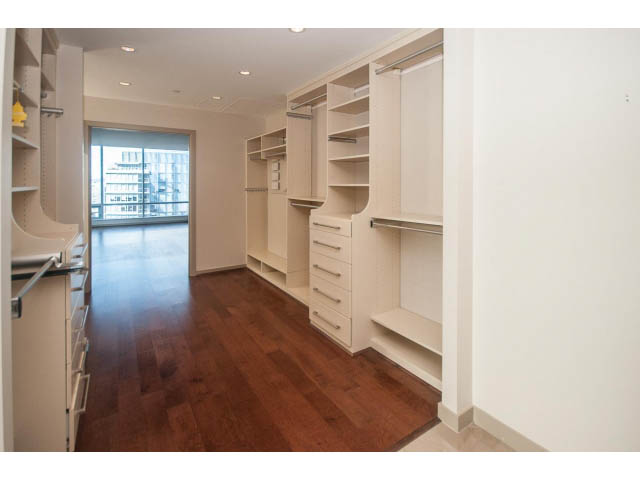 Bright kitchen with modern white cabinetry, hardwood floors, and a city view. - 2200 - 1169 W Cordova St, Vancouver Downtown