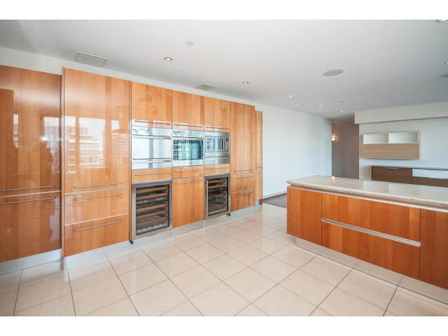 Bright kitchen with light wood cabinets, granite countertops, and stainless steel appliances. - 2200 - 1169 W Cordova St, Vancouver Downtown