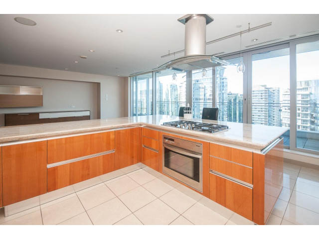 Bright kitchen with modern appliances, city view, and sleek countertops. - 2200 - 1169 W Cordova St, Vancouver Downtown