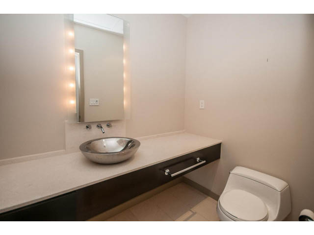 Bright bathroom with modern sink, lighted mirror, and sleek toilet. - 2200 - 1169 W Cordova St, Vancouver Downtown