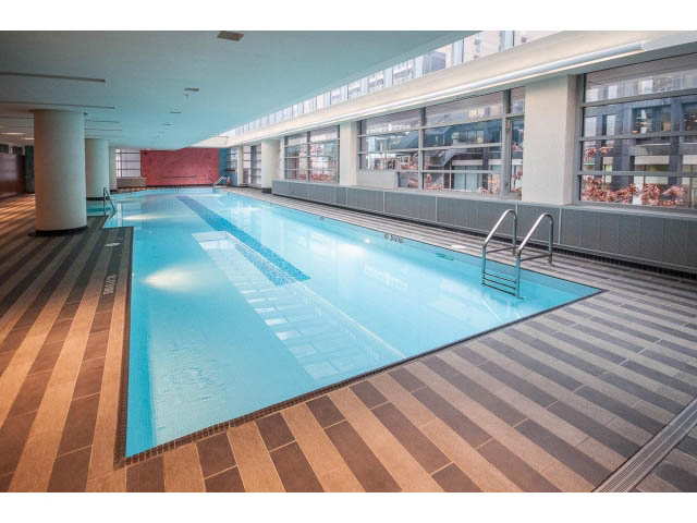 Spacious, modern indoor pool with city view and wooden flooring. - 2200 - 1169 W Cordova St, Vancouver Downtown