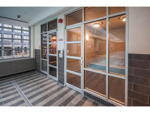 Spacious bathroom with large glass doors, modern fixtures, and city view. - 2200 - 1169 W Cordova St, Vancouver Downtown