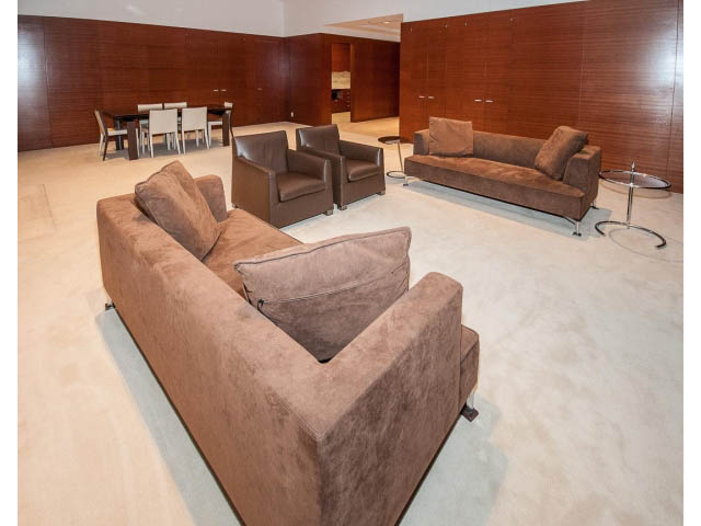 Living room with plush brown furniture and modern glass coffee table. - 2200 - 1169 W Cordova St, Vancouver Downtown