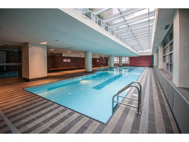 Spacious, modern living room with large windows and a cozy fireplace. - 2200 - 1169 W Cordova St, Vancouver Downtown