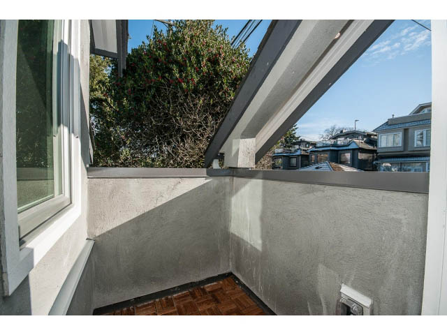 Balcony with hardwood flooring and city view. - 4216 W 10th Ave, Vancouver West Side