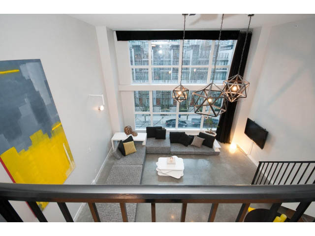 Furnished loft with modern decor, large windows, and geometric pendant lights. - 307 - 1238 Seymour Street, Vancouver Downtown
