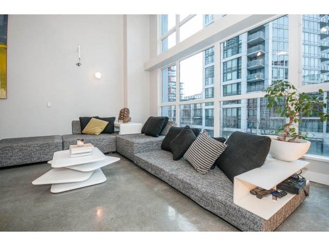 Bright living room with modern furniture and city view. - 307 - 1238 Seymour Street, Vancouver Downtown