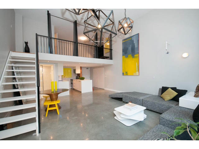 Furnished loft with modern decor, white walls, and a geometric chandelier. - 307 - 1238 Seymour Street, Vancouver Downtown