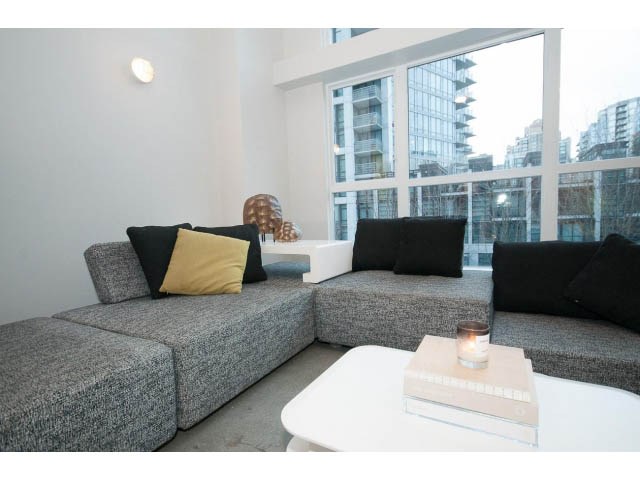 Furnished living room with modern furniture, large windows, and city view. - 307 - 1238 Seymour Street, Vancouver Downtown