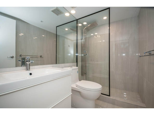 Bright bathroom with white fixtures and large mirror, modern design. - 307 - 1238 Seymour Street, Vancouver Downtown