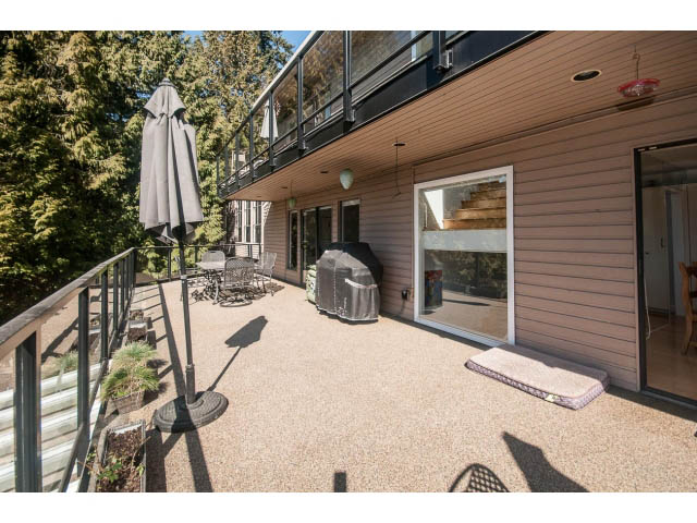 Furnished patio with outdoor furniture and a view of greenery. - 3855 Bayridge Ave, West Vancouver
