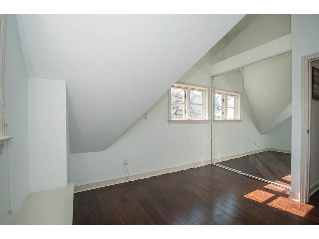 Bright attic bedroom with hardwood floors and large windows. - 3131 Collingwood St, Vancouver West Side