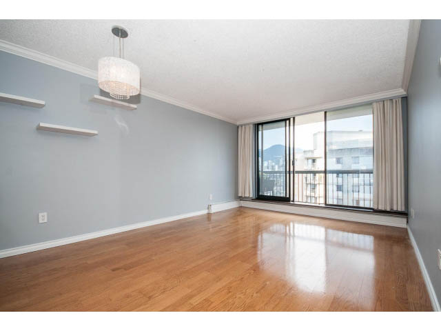 Bright living room with hardwood floors and city view. - 1604 - 145 St Georges Ave, North Vancouver