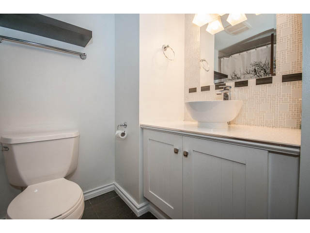 Bright bathroom with white cabinetry and a modern sink. - 1604 - 145 St Georges Ave, North Vancouver