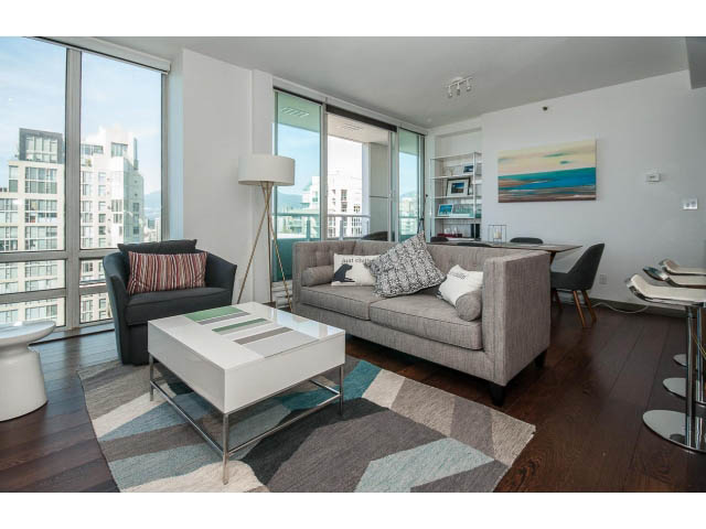 Bright living room with city view, hardwood floors, and modern furnishings. - 2404 - 1500 Hornby St, Vancouver Downtown
