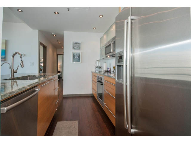 Bright kitchen with granite countertops, hardwood floors, and stainless steel appliances. - 2404 - 1500 Hornby St, Vancouver Downtown