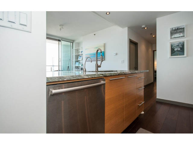 Bright kitchen with granite countertops, hardwood floors, and a city view. - 2404 - 1500 Hornby St, Vancouver Downtown