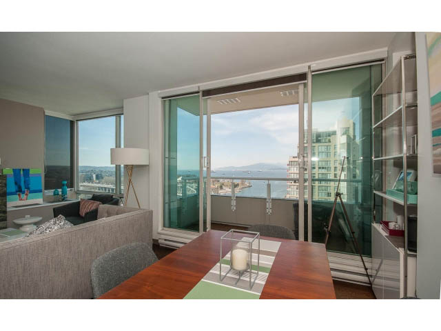 Bright dining area with hardwood floors, city view, and modern decor. - 2404 - 1500 Hornby St, Vancouver Downtown